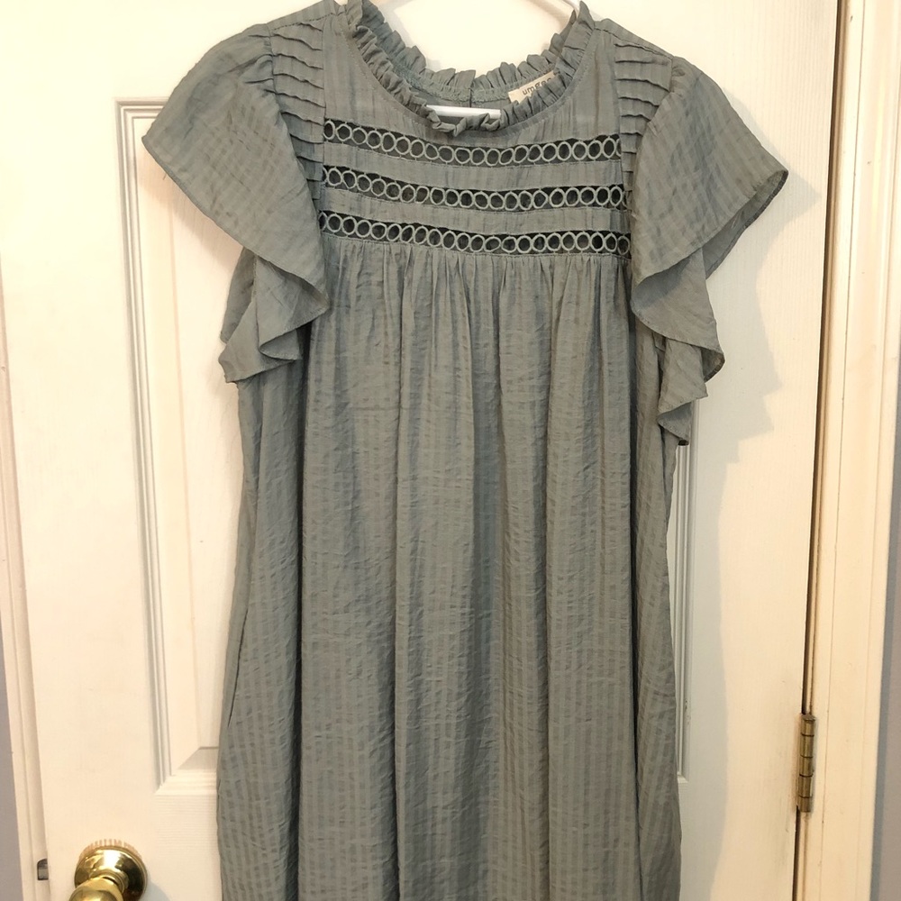 Umgee brand dress with keyhole design on chest.